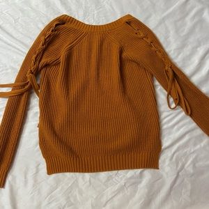 Guess sweater with crisscross on the arms
